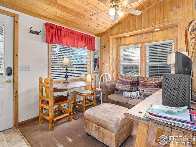 220 Virginia Dr Unit 8, Estes Park, CO 80517 - living area featuring vaulted ceiling, a ceiling fan, wood walls, and wood ceiling
