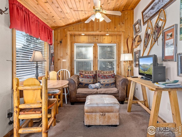 220 Virginia Dr Unit 8, Estes Park, CO 80517 - living area featuring wooden walls, lofted ceiling, a ceiling fan, carpet flooring, and wooden ceiling