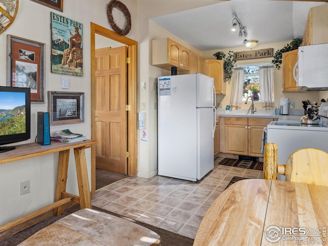 220 Virginia Dr Unit 8, Estes Park, CO 80517 - kitchen featuring white appliances, light countertops, light tile patterned floors, track lighting, and light brown cabinets