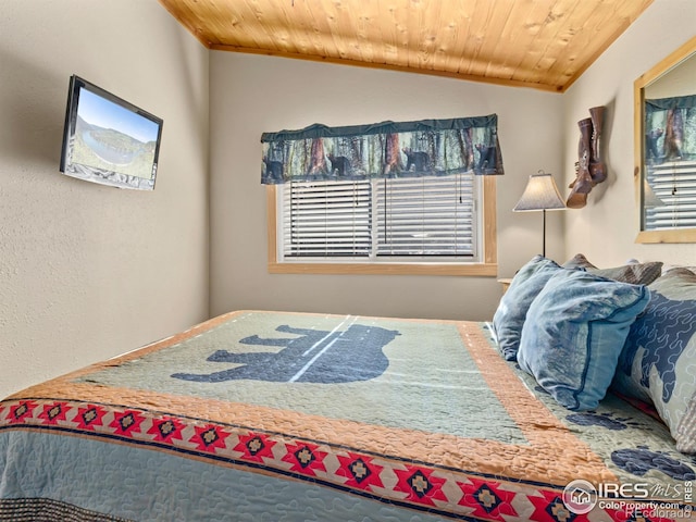 bedroom featuring wooden ceiling and vaulted ceiling