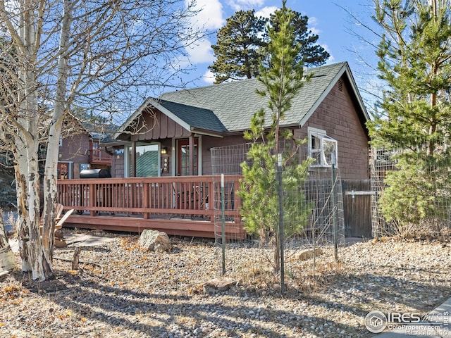 220 Virginia Dr Unit 8, Estes Park, CO 80517 - view of front of house with a wooden deck and roof with shingles