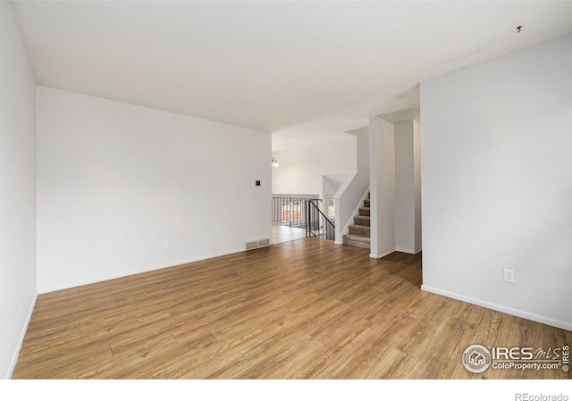 unfurnished room featuring light hardwood / wood-style flooring