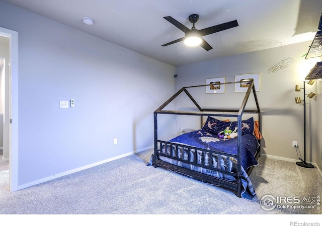 bedroom with ceiling fan and carpet floors