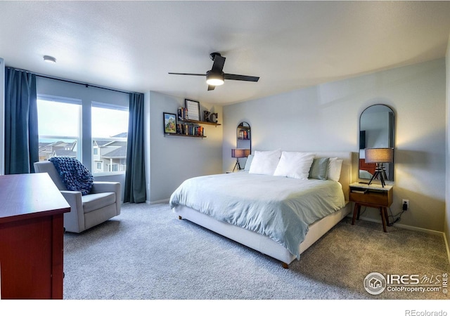 carpeted bedroom with ceiling fan