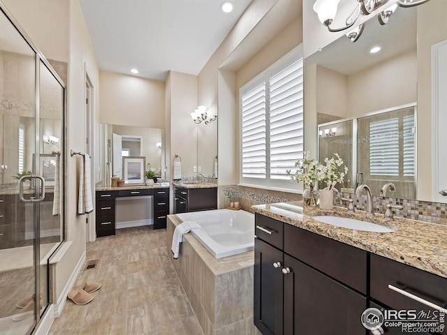 bathroom featuring wood-type flooring, vanity, and separate shower and tub