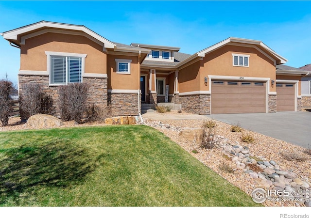 view of front of home with a front lawn and a garage