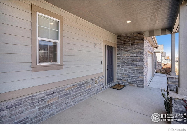 doorway to property featuring a garage