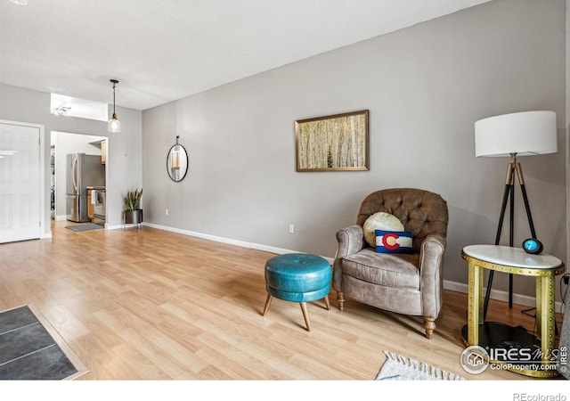 sitting room featuring wood-type flooring