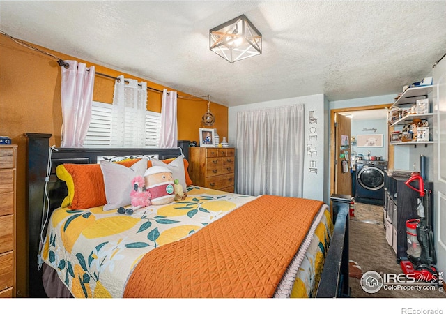 carpeted bedroom with a textured ceiling and washer / clothes dryer