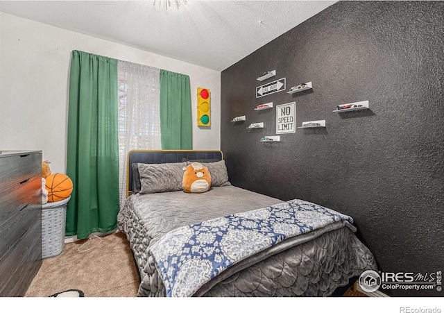 bedroom featuring a textured ceiling, carpet floors, and vaulted ceiling