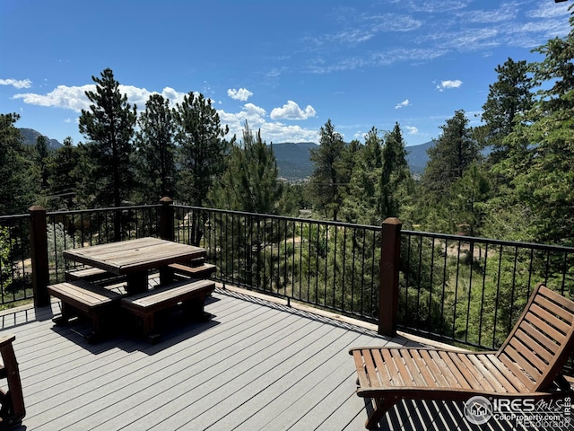 wooden deck featuring a mountain view