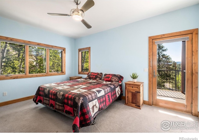 carpeted bedroom featuring ceiling fan and access to outside