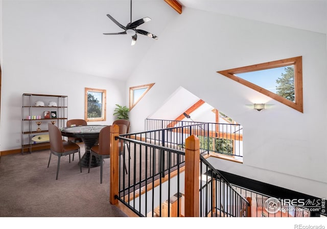 interior space with beamed ceiling, high vaulted ceiling, a wealth of natural light, and ceiling fan