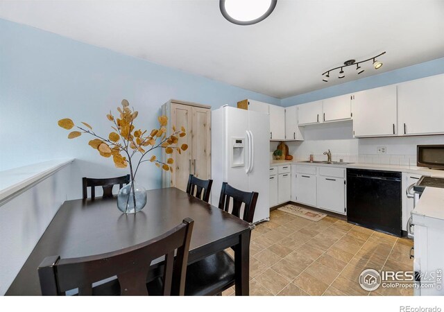 kitchen with white cabinets, dishwasher, white fridge with ice dispenser, and sink