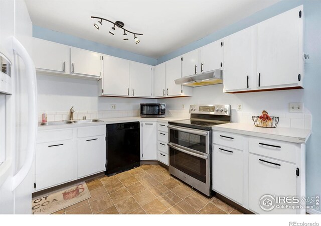 kitchen featuring white cabinets, stainless steel appliances, and sink