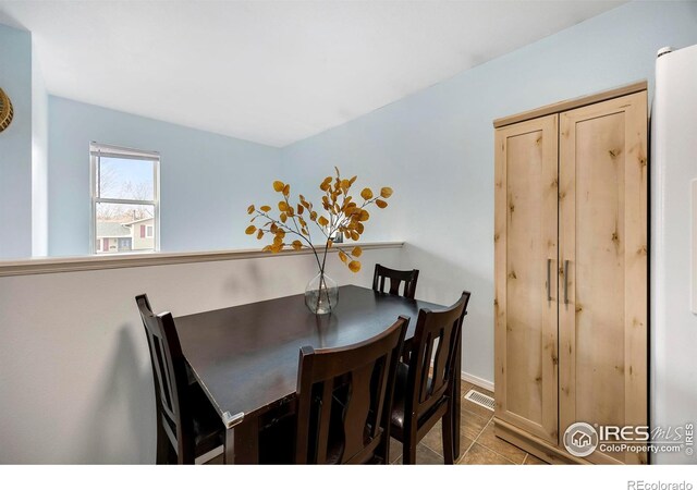 dining space with light wood-type flooring