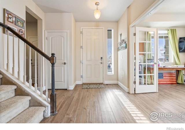 entrance foyer with light wood-type flooring