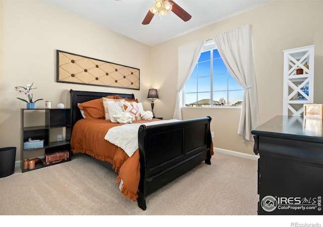 carpeted bedroom with ceiling fan