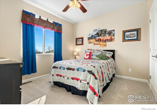 bedroom with light carpet and ceiling fan