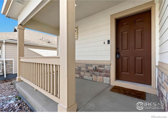 property entrance featuring covered porch