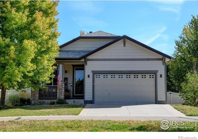 craftsman-style house with a porch, a garage, and a front lawn