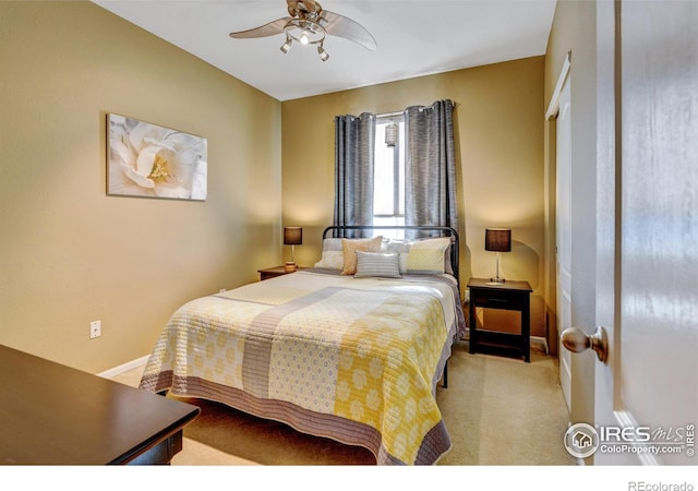 carpeted bedroom with ceiling fan