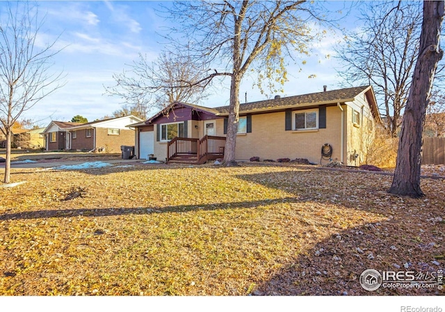 ranch-style house with a front lawn and a garage