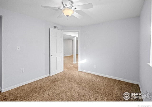 unfurnished room featuring carpet flooring and ceiling fan