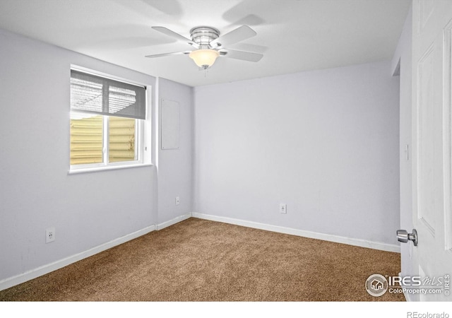 spare room with carpet flooring and ceiling fan