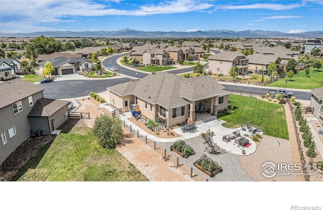 birds eye view of property featuring a mountain view