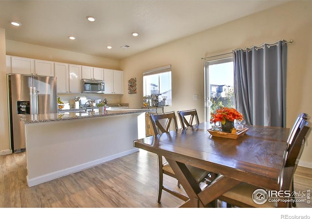 dining space featuring light hardwood / wood-style floors