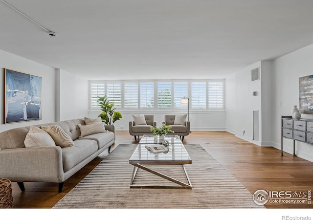 1850 Folsom St Unit 611, Boulder, CO 80302 - living area with wood finished floors and baseboards