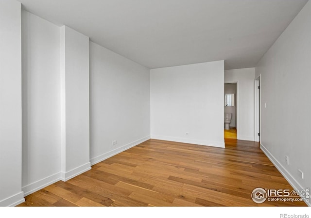 1850 Folsom St Unit 611, Boulder, CO 80302 - unfurnished room with light wood-style floors and baseboards