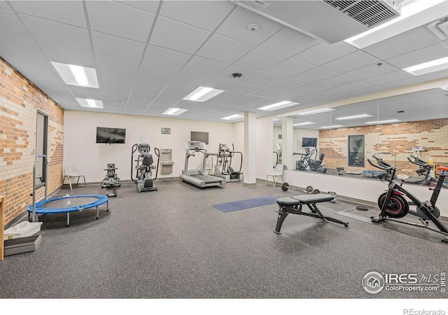 1850 Folsom St Unit 611, Boulder, CO 80302 - exercise room with brick wall, a paneled ceiling, and baseboards