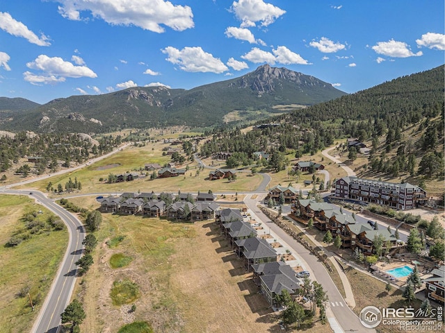 birds eye view of property with a mountain view