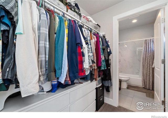 spacious closet featuring tile patterned floors