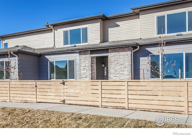 5086 Mckinnon Ct, Timnath, CO 80547 - view of front of house featuring stone siding