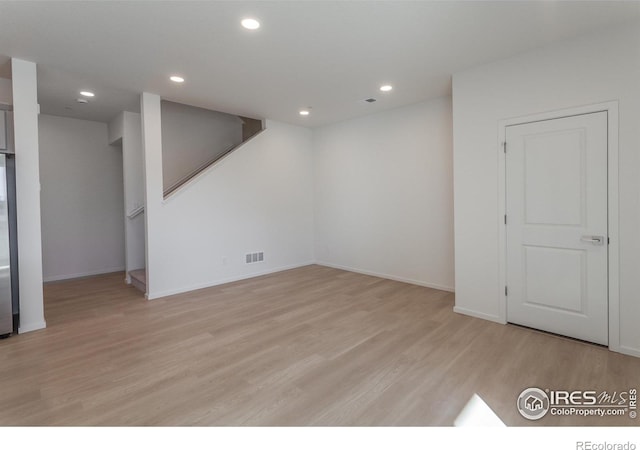 5086 Mckinnon Ct, Timnath, CO 80547 - basement with light wood-type flooring, recessed lighting, and stairs