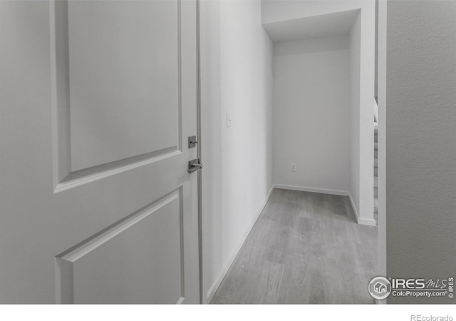 5086 Mckinnon Ct, Timnath, CO 80547 - hall featuring wood finished floors and baseboards