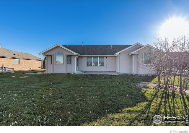 ranch-style house with a front yard