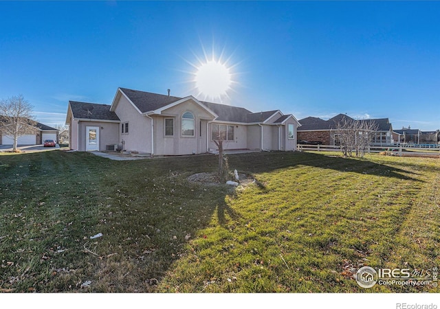 ranch-style house featuring a front lawn