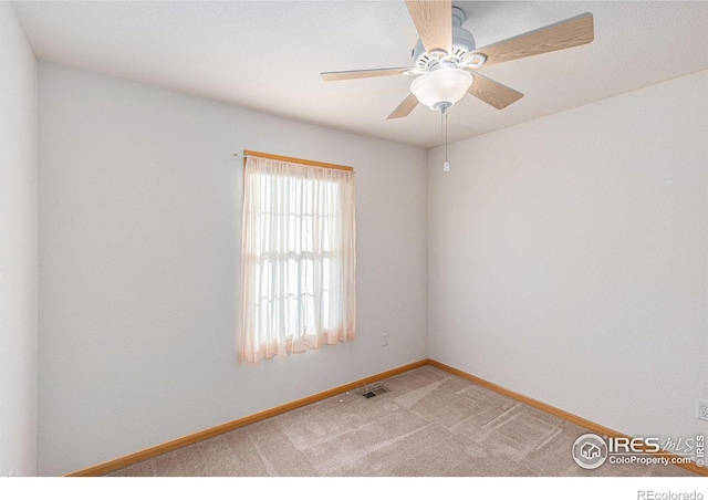 empty room with light carpet and ceiling fan