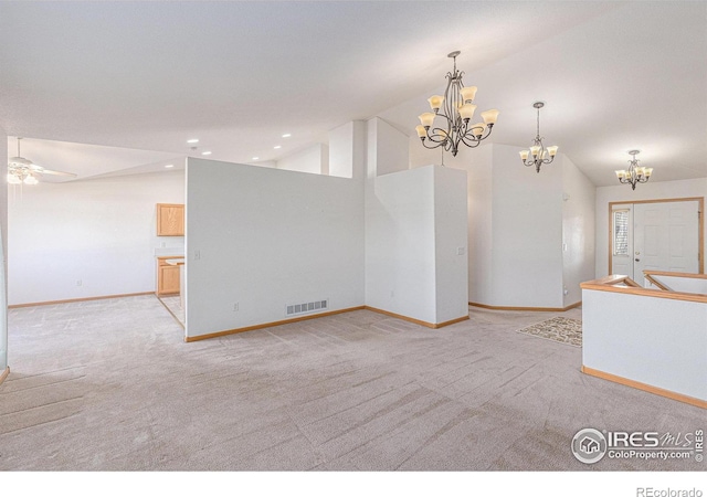 interior space with light colored carpet, ceiling fan, and lofted ceiling