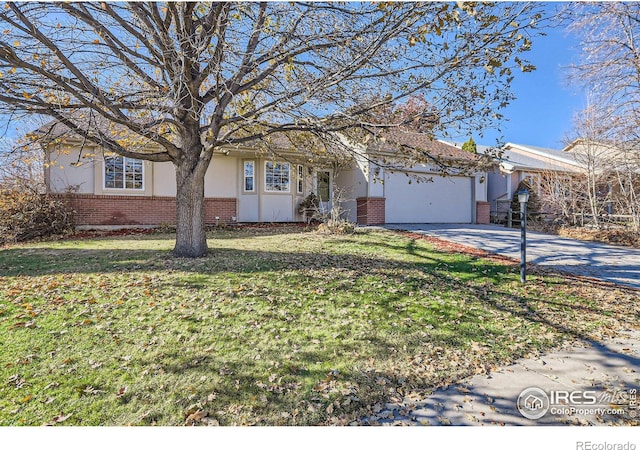 view of front of house with a garage and a front lawn