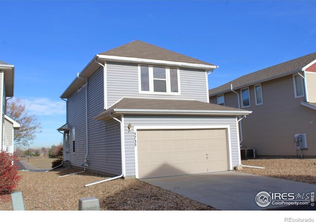 front of property with a garage