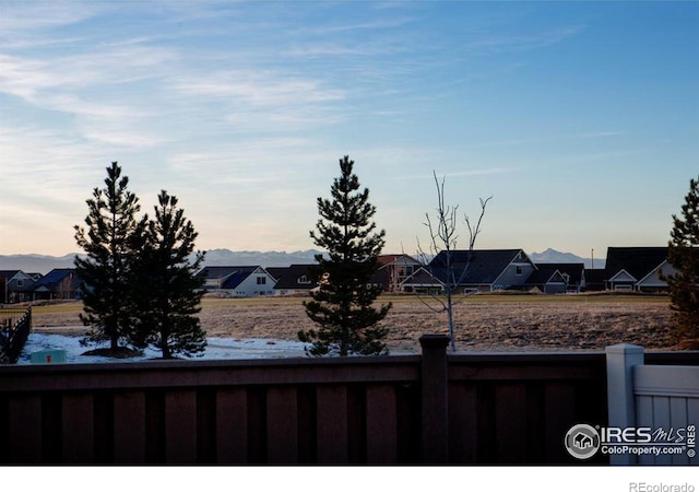 view of yard featuring a residential view and fence