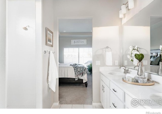 bathroom with double vanity, a shower, ensuite bath, tile patterned flooring, and a sink