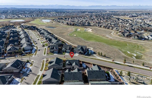 birds eye view of property with view of golf course and a residential view