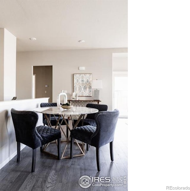 dining space featuring dark wood-style floors