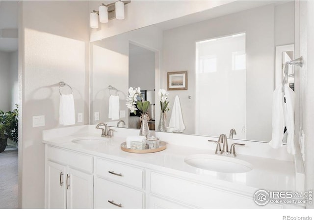 full bath with a sink and double vanity